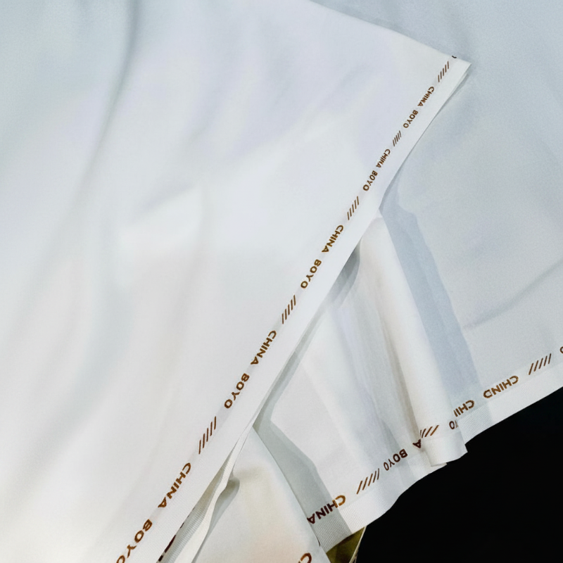 China Boyo Boski off white unstitched fabric with branded selvedge by Mian Cloth